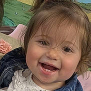 Soa participe au concours pour gagner de l'argent avec cette photo : toddler, child, smiling, face, denim_jacket, white_clothing, hair_tied, indoors, mural, painting, fields, clouds, happy, cute, portrait, baby, person, young_child, casual_wear, cheerful