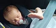 Joy a rejoint le concours — aidez-le/la à gagner de superbes lots ! baby, blanket, car_seat, child, closeup, clothing, cute, foot, head, indoor, infant, newborn, pacifier, peaceful, person, resting, seatbelt, skin, sleeping, soft