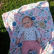 Juniper joined the competition — help win amazing prizes! baby, infant, child, portrait, lying_down, outdoor, grass, blanket, floral, pink, headband, bow, clothing, onesie, pants, socks, milestone, four_months, face, photography