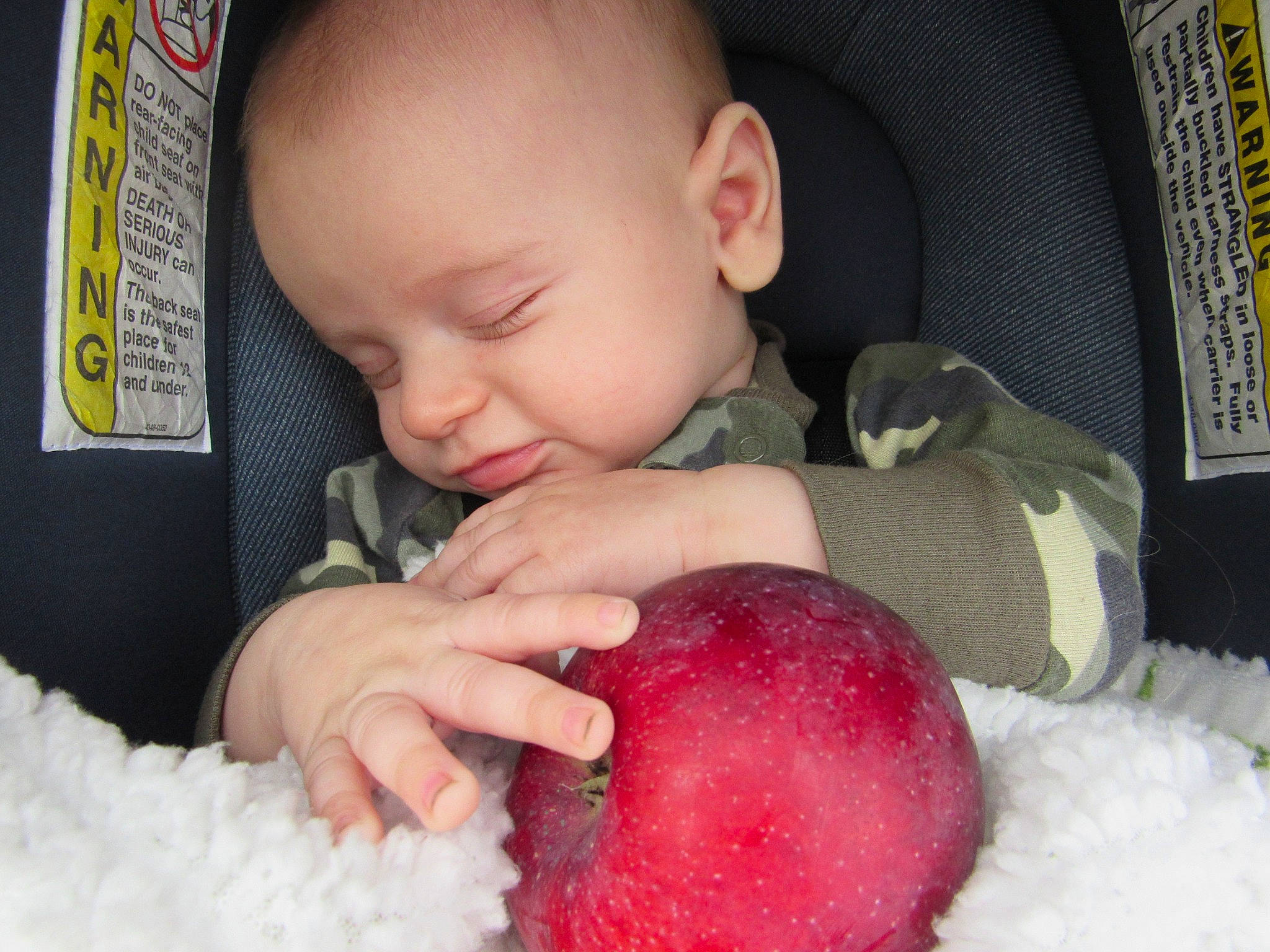 Remington is registered to the contest to win money with this photo: arm, baby, baby_toddler_clothing, cheek, chin, eye, face, facial_expression, finger, fun, hand, head, human_body, iris, lip, mouth, nose, person, pink, product