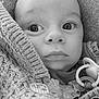Rayan a rejoint le concours — aidez-le/la à gagner de superbes lots ! baby, black_and_white, button, candid, child, closeup, cozy, cute, expression, face, indoor, infant, knitted_sweater, pacifier, portrait, soft, texture, warm_clothing, wrapped, young_child