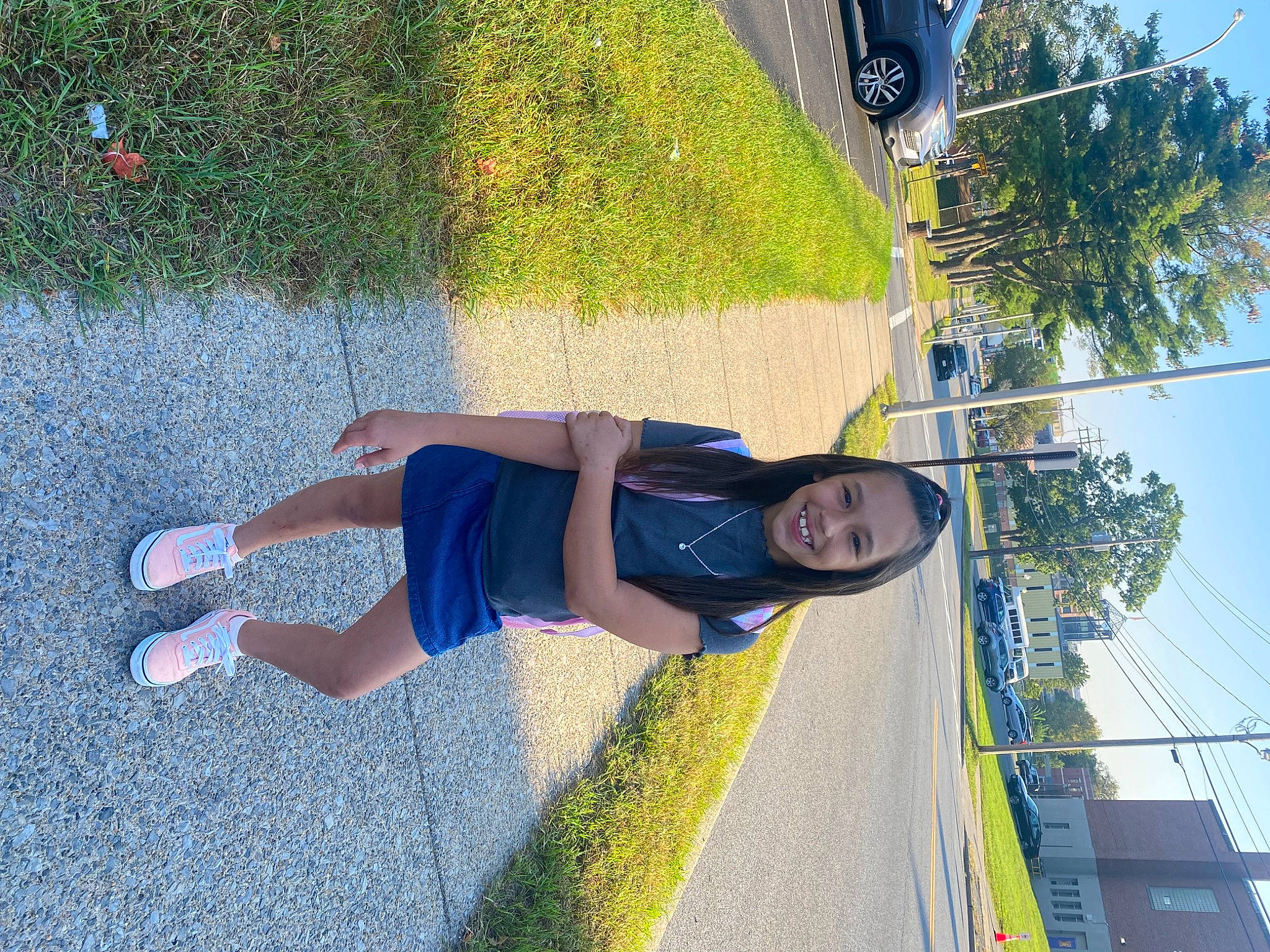 Destinee is registered to the contest to win money with this photo: asphalt, electric_blue, fun, grass, human_leg, joy, knee, leisure, people_in_nature, person, physical_fitness, plant, recreation, shadow, shorts, sidewalk, sky, sports, sportswear, t_shirt