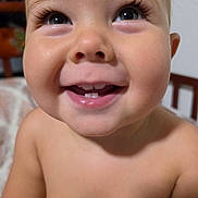 Ronen is registered to the contest to win money with this photo: baby, smile, teeth, face, child, close_up, happy, innocence, skin, eyes, portrait, indoor, expression, joy, cute, young, human, person, head, cheeks