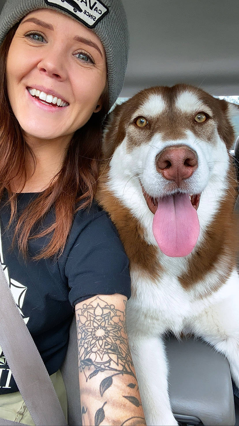 Lydia joined the competition — help win amazing prizes! brown_hair, canidae, cap, carnivore, companion_dog, dog, dog_breed, facial_expression, fawn, fur, gesture, happy, hat, skin, sled_dog, smile, snout, sporting_group, whiskers, wrist