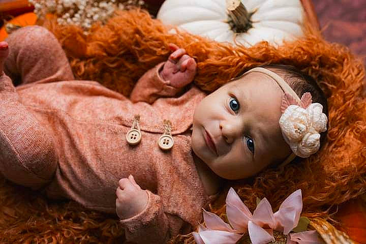 Paisley joined the competition — help win amazing prizes! blossom, brown_hair, cheek, child, close_up, doll, eyelash, fawn, flower, fur, happy, headwear, leaf, person, petal, pumpkin, skin, stuffed_toy, textile, toy