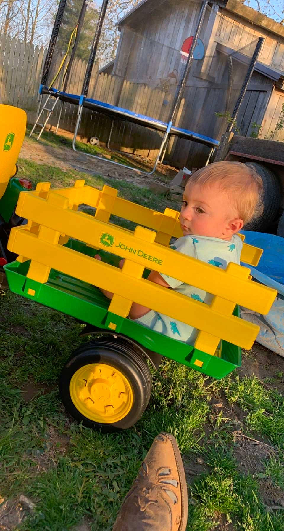 Issac is registered to the contest to win money with this photo: automotive_tire, automotive_wheel_system, baby, baby_toddler_clothing, child, city, fun, grass, motor_vehicle, orange, person, play, soil, tire, toddler, transport, tread, wheel, wood, yard