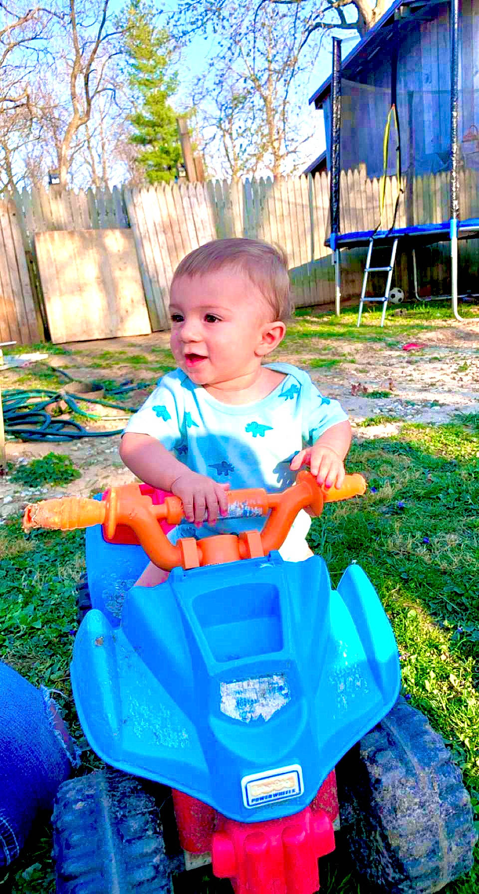 Issac joined the competition — help win amazing prizes! automotive_design, baby, baby_toddler_clothing, blue, electric_blue, fun, grass, hairstyle, happy, leisure, motor_vehicle, person, plant, public_space, recreation, riding_toy, tire, toddler, tree, vehicle