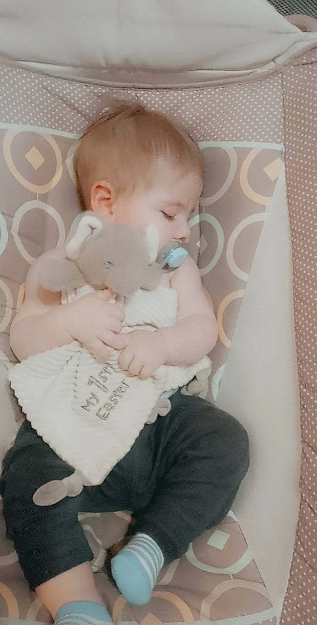 Ashton is registered to the contest to win money with this photo: abdomen, baby, baby_products, baby_toddler_clothing, cheek, chest, child, comfort, finger, hand, iris, lap, pattern, person, pink, sitting, skin, sleeve, sock, thigh