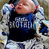 Julian joined the competition — help win amazing prizes! baby, sleeping, infant, clothing, pajamas, person, feet, blanket, lap, text, indoor, cute, child, newborn, relaxing, patterned_clothing, family, cozy, soft, comfort