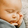 baby, sleeping, infant, blanket, cozy, closeup, soft_focus, peaceful, wrapped, cute, newborn, face, child, rest, portrait, skin, hand, delicate, calm, indoors