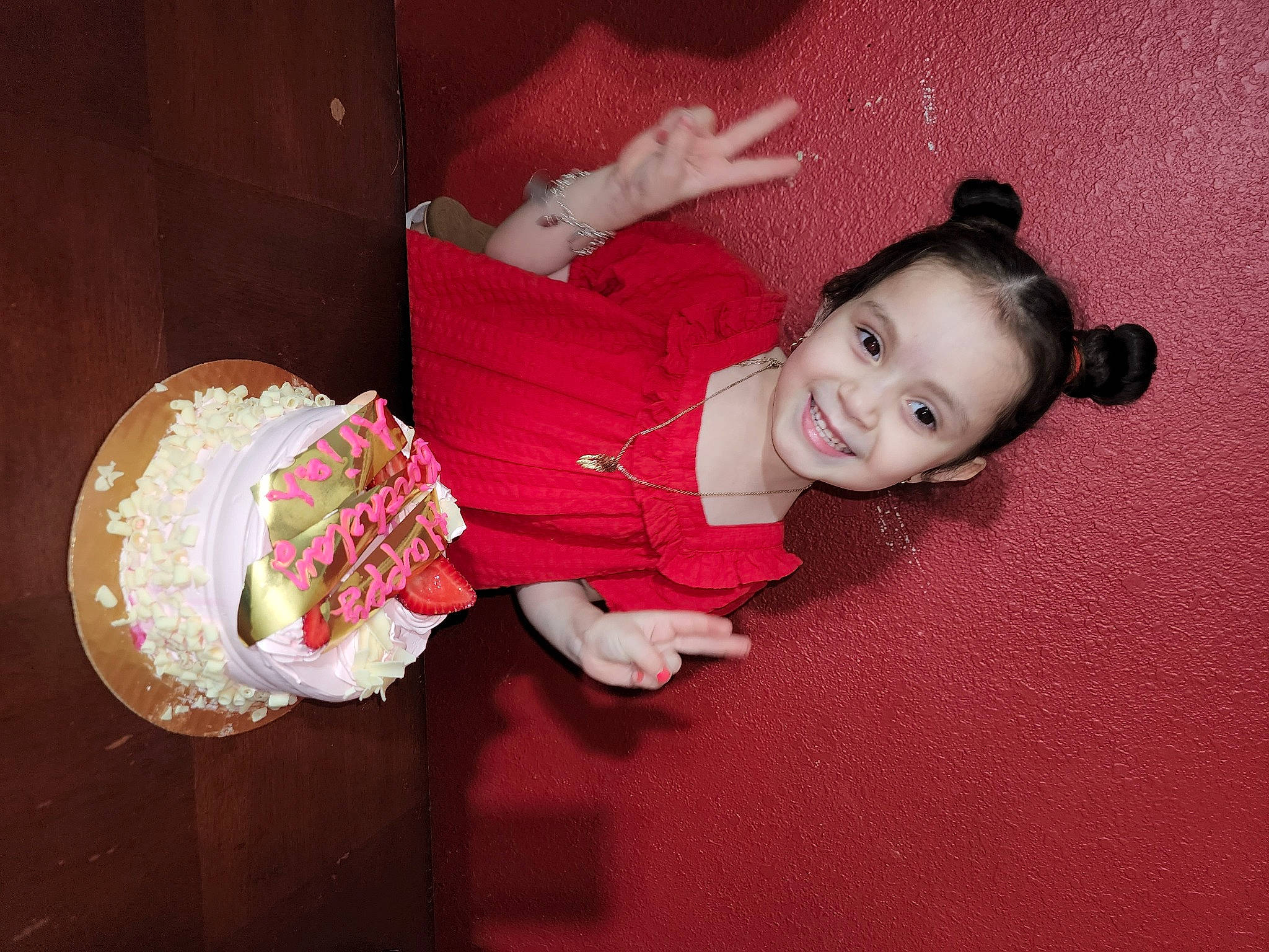 Ariah is registered to the contest to win money with this photo: baby, baby_toddler_clothing, carmine, cheek, child, facial_expression, finger, flash_photography, flooring, fun, happy, joy, magenta, pastry, person, pink, room, sitting, smile, textile