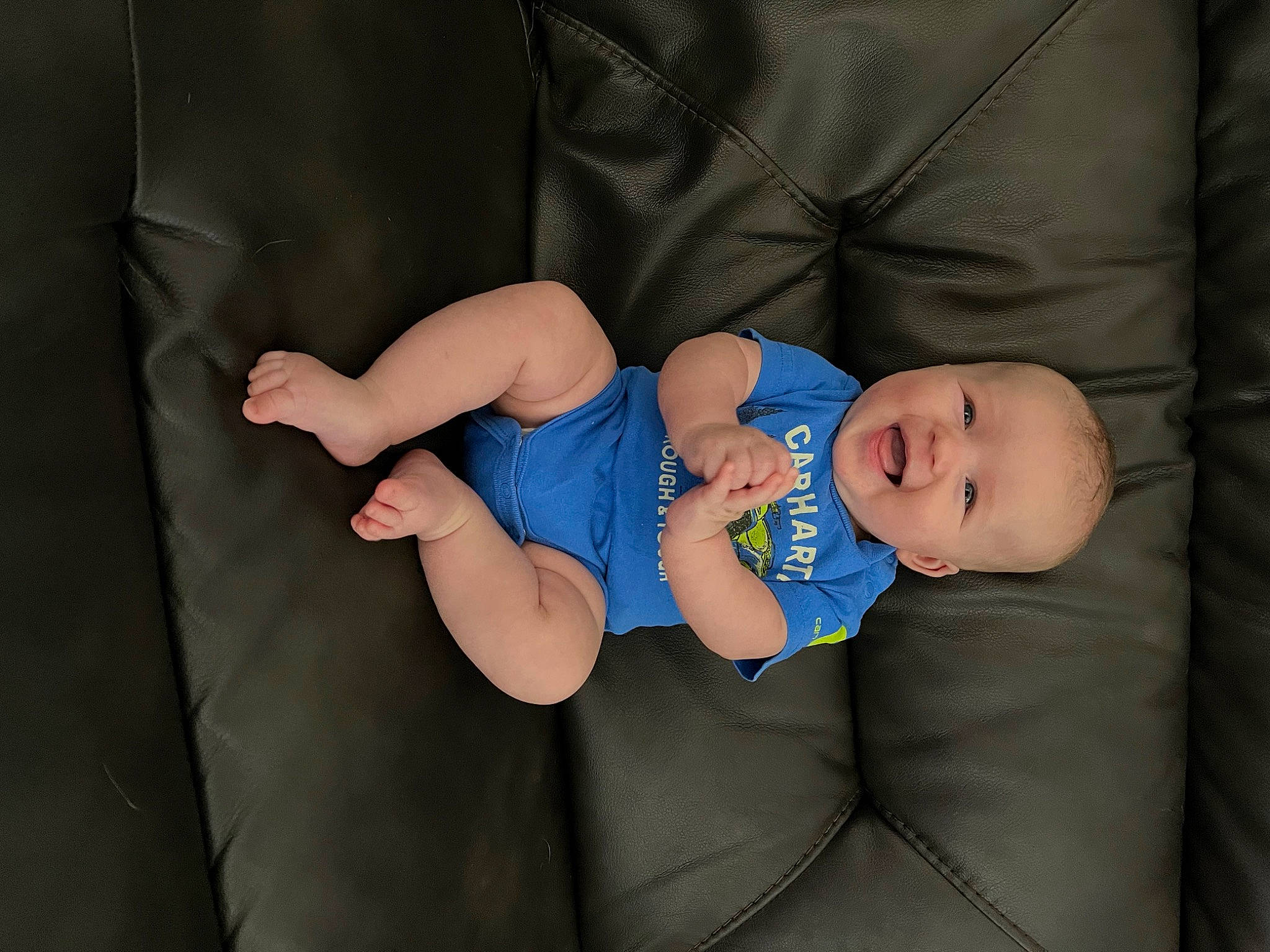 Harrison joined the competition — help win amazing prizes! baby, baby_products, baby_toddler_clothing, child, comfort, couch, elbow, electric_blue, finger, hat, human_leg, knee, lap, leg, person, sitting, sleeve, sock, textile, thigh