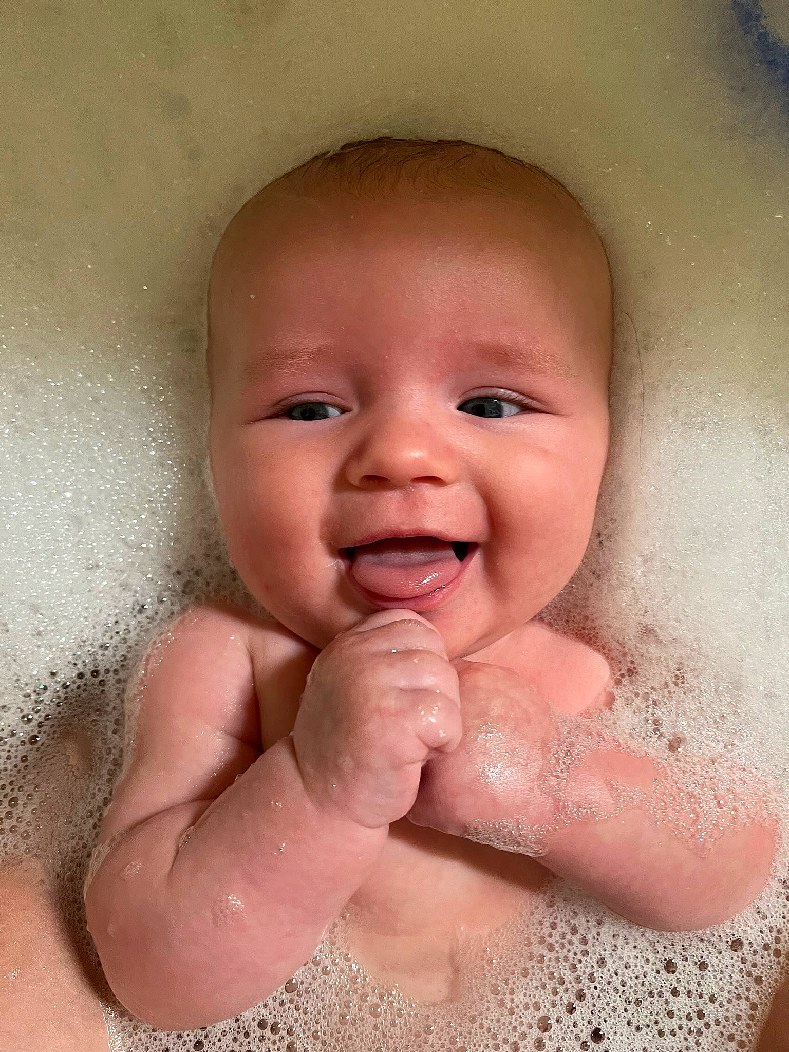Harrison is registered to the contest to win money with this photo: baby, baby_bathing, bathing, cheek, eyebrow, face, finger, fluid, gesture, happy, iris, lip, mouth, nose, person, pink, skin, smile, stomach, toddler