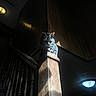 cat, tabby, stairs, wood, post, sunlight, shadow, indoor, animal, pet, feline, dark, light, contrast, resting, quiet, home, wood_paneling, railing, moody