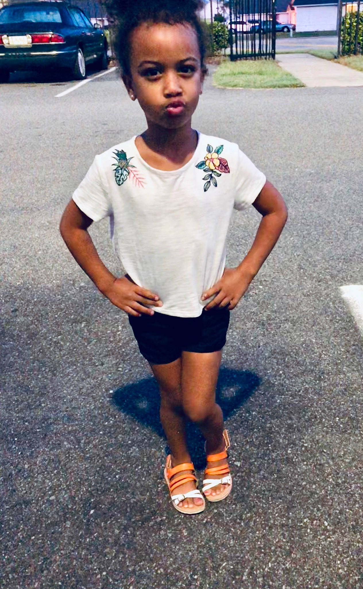 Essence is registered to the contest to win money with this photo: black_hair, child, cool, face, fashion, footwear, hairstyle, head, human, person, shoe, shorts, skin, smile, snapshot, street_fashion, style, t_shirt, toddler, vacation