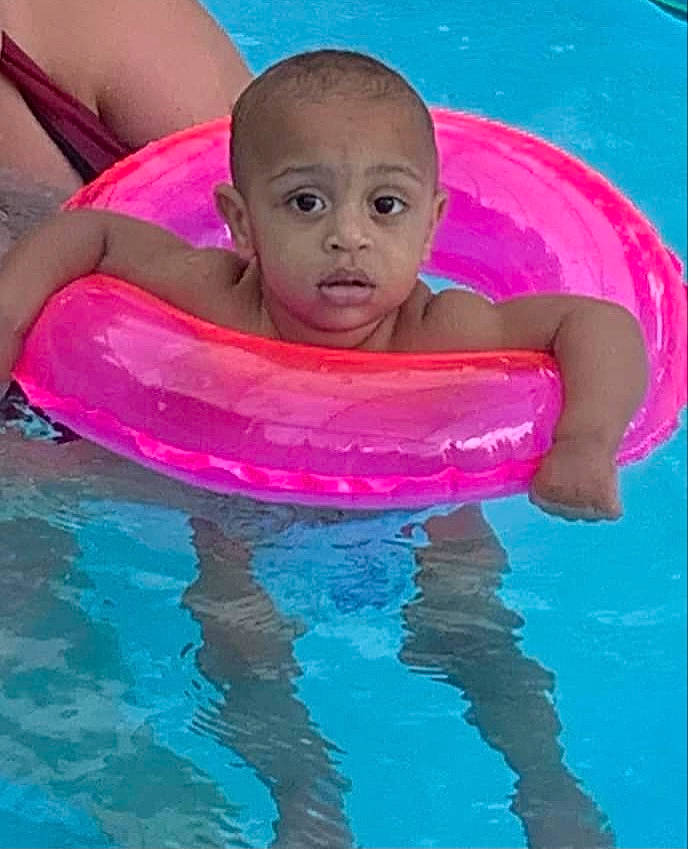 Maveryk is registered to the contest to win money with this photo: arm, art, baby, baby_float, baby_products, bathing, chest, child, fluid, fun, happy, leisure, magenta, person, personal_protective_equipment, pink, play, recreation, swimming_pool, toddler