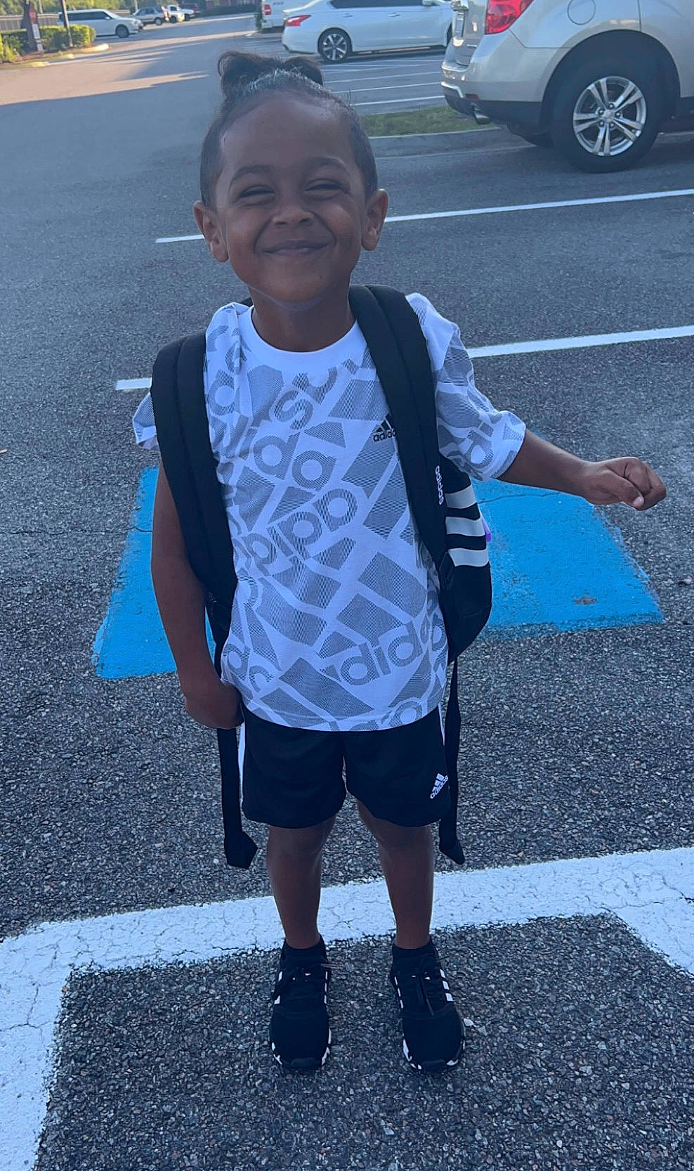 Malcolm joined the competition — help win amazing prizes! asphalt, black, blue, cool, face, hand, infrastructure, joy, line, people, person, photograph, public_space, road_surface, shorts, sidewalk, sleeve, smile, standing, t_shirt