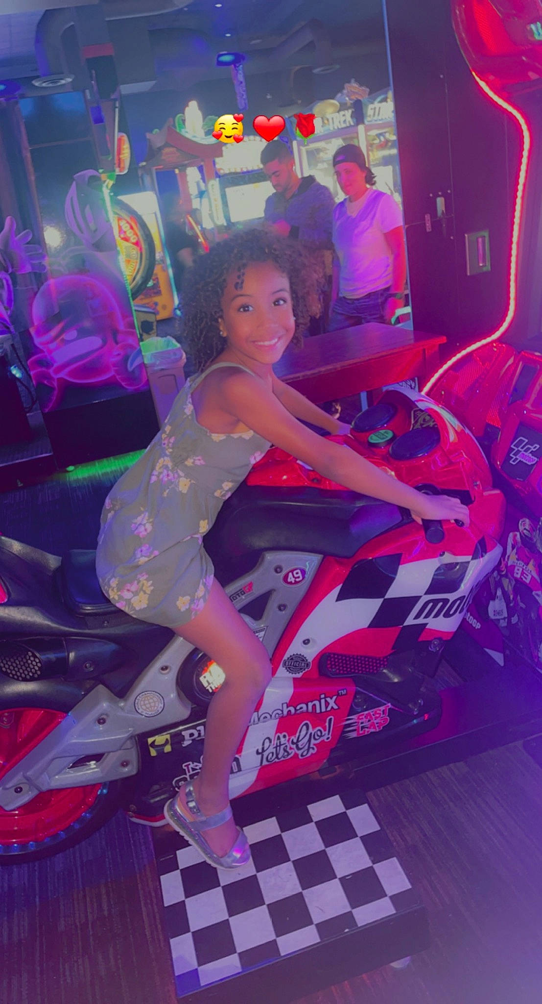 Essence is registered to the contest to win money with this photo: automotive_design, black_hair, bumper, entertainment, event, fashion_design, flash_photography, fun, human_leg, leisure, magenta, music, neon, performing_arts, person, pink, purple, sandal, shoe, smile