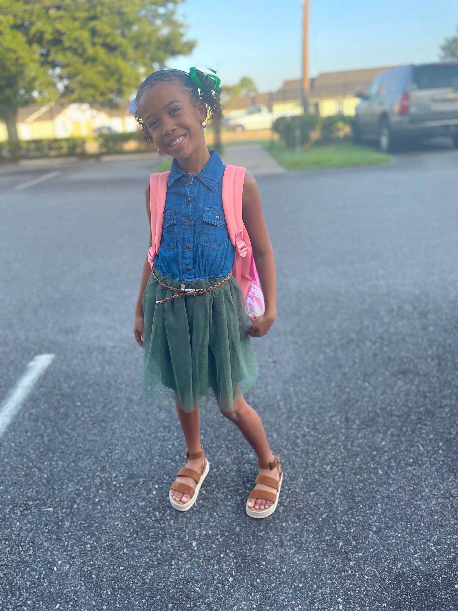 Essence is registered to the contest to win money with this photo: asphalt, child, electric_blue, fashion_accessory, fun, grass, happy, jewellery, joy, leisure, magenta, pattern, person, recreation, road, road_surface, sidewalk, sky, street, toddler