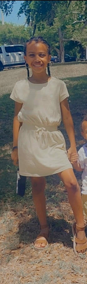 Essence joined the competition — help win amazing prizes! calf, chest, elbow, event, foot, fun, gesture, grass, human_leg, joy, knee, leg, people_in_nature, person, shorts, sitting, sleeve, t_shirt, thigh, trunk