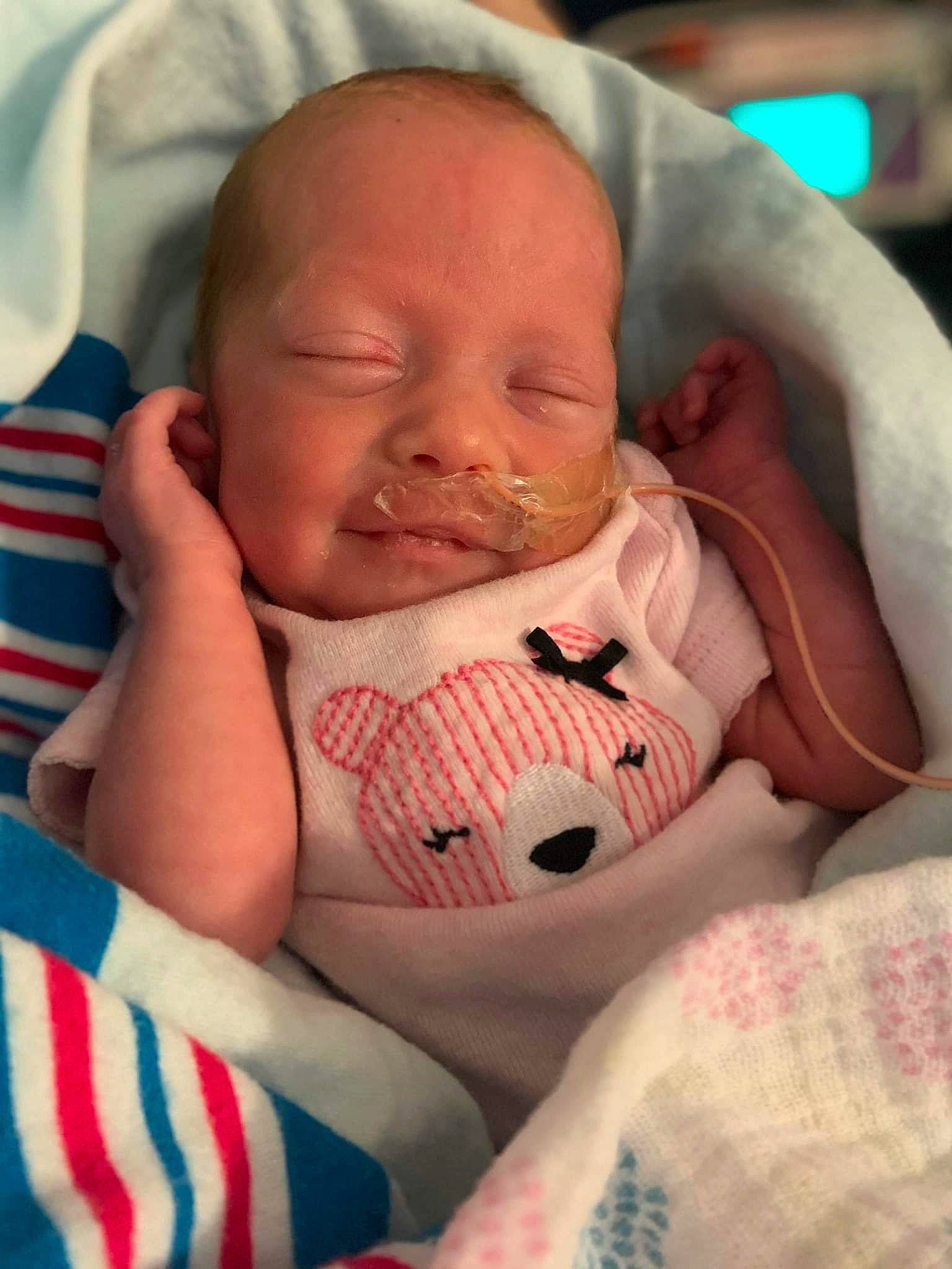 Ensley joined the competition — help win amazing prizes! baby, baby_toddler_clothing, cheek, child, chin, close_up, comfort, eye, eyebrow, finger, happy, iris, linens, lip, mouth, neck, nose, person, skin, smile