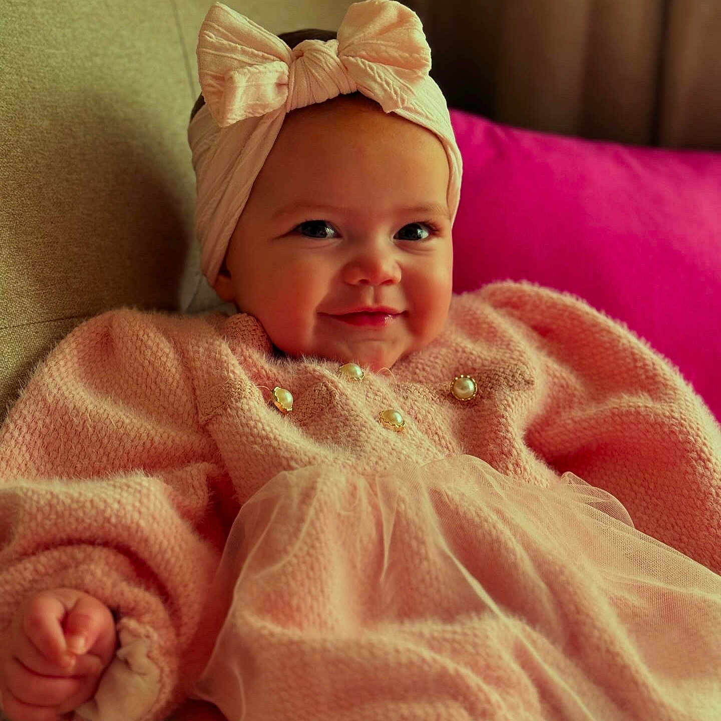 Azaniah is registered to the contest to win money with this photo: accessories, baby, babylaughing, blanket, clothing, cushion, face, happy, hat, head, homedecor, jewelry, necklace, newborn, person, photography, portrait, quilt, sitting, smile
