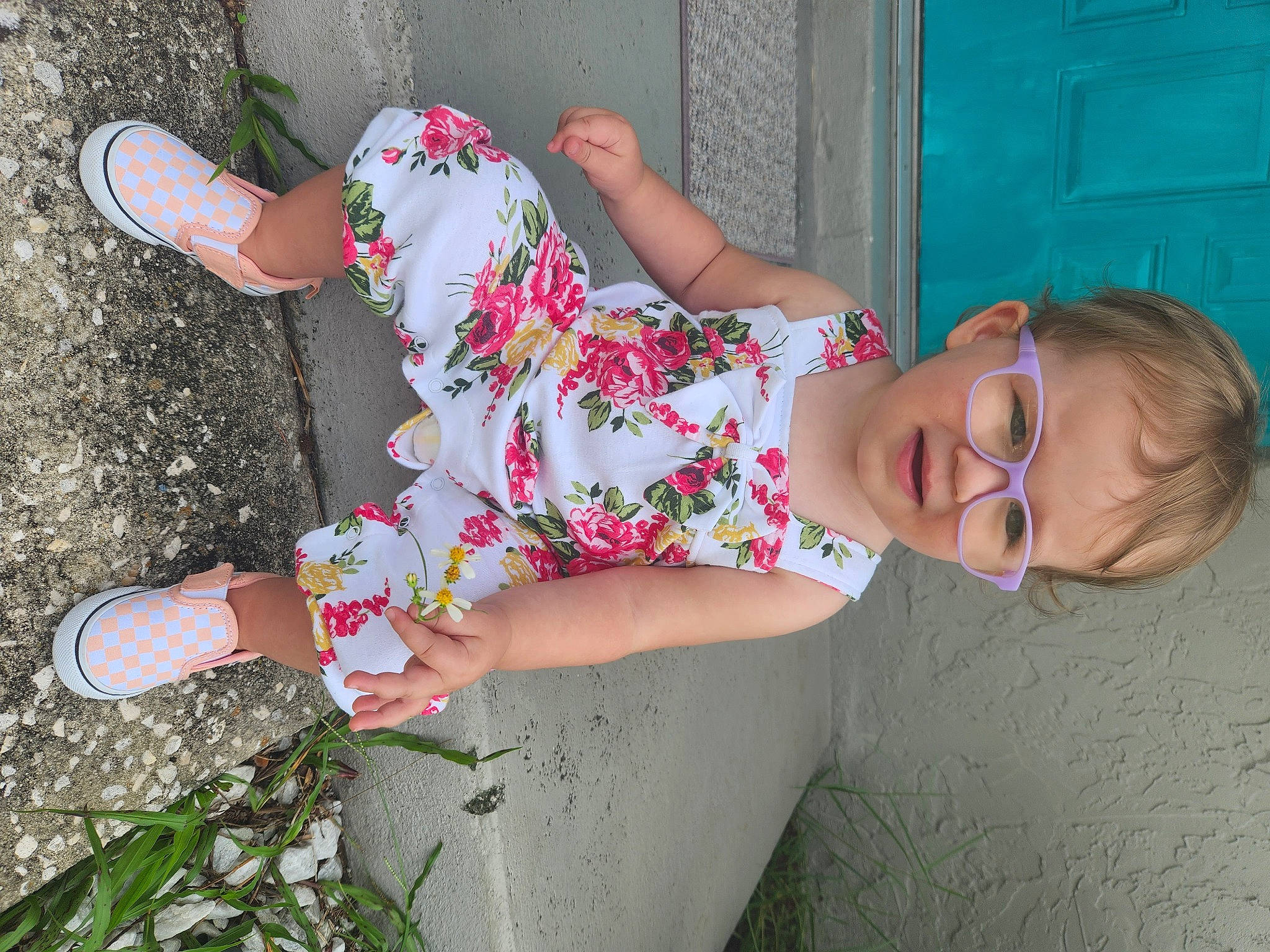Ashlee is registered to the contest to win money with this photo: baby_toddler_clothing, dress, finger, foot, grass, happy, human_leg, joint, joy, knee, leg, magenta, pattern, person, pink, plant, skin, smile, summer, textile