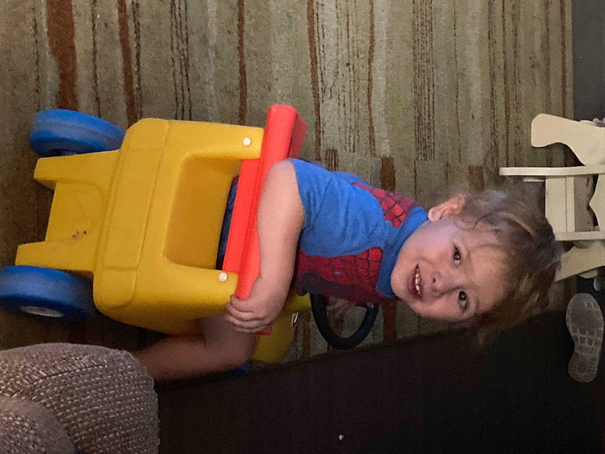 Kason joined the competition — help win amazing prizes! baby_products, chair, child, electric_blue, fun, happy, joy, leisure, person, plastic, play, room, sitting, smile, standing, tire, toddler, vacation, wheel, wood