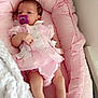 baby, infant, pacifier, pink, blanket, cushion, clothing, cute, newborn, sleepwear, footwear, socks, frills, portrait, resting, indoors, soft, comfort, child, person