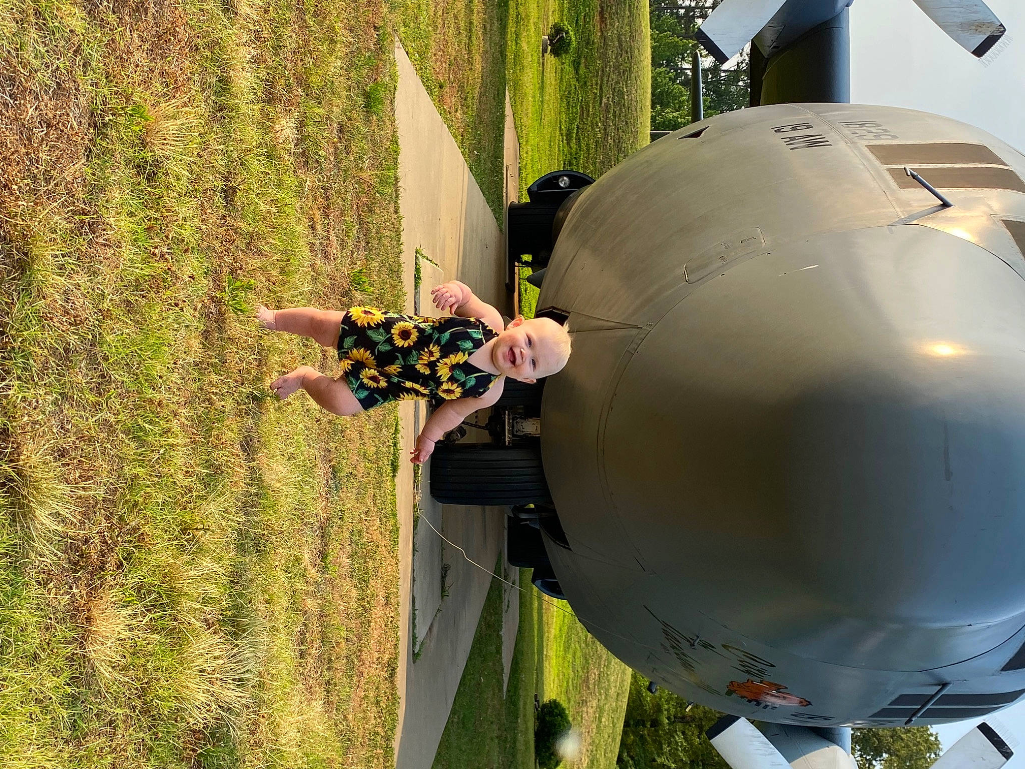 Brentley joined the competition — help win amazing prizes! aerospace_engineering, aerospace_manufacturer, air_travel, aircraft, aircraft_engine, airliner, airplane, aviation, flap, flight, grass, helmet, joy, military_aircraft, monoplane, person, plant, recreation, toddler, tree