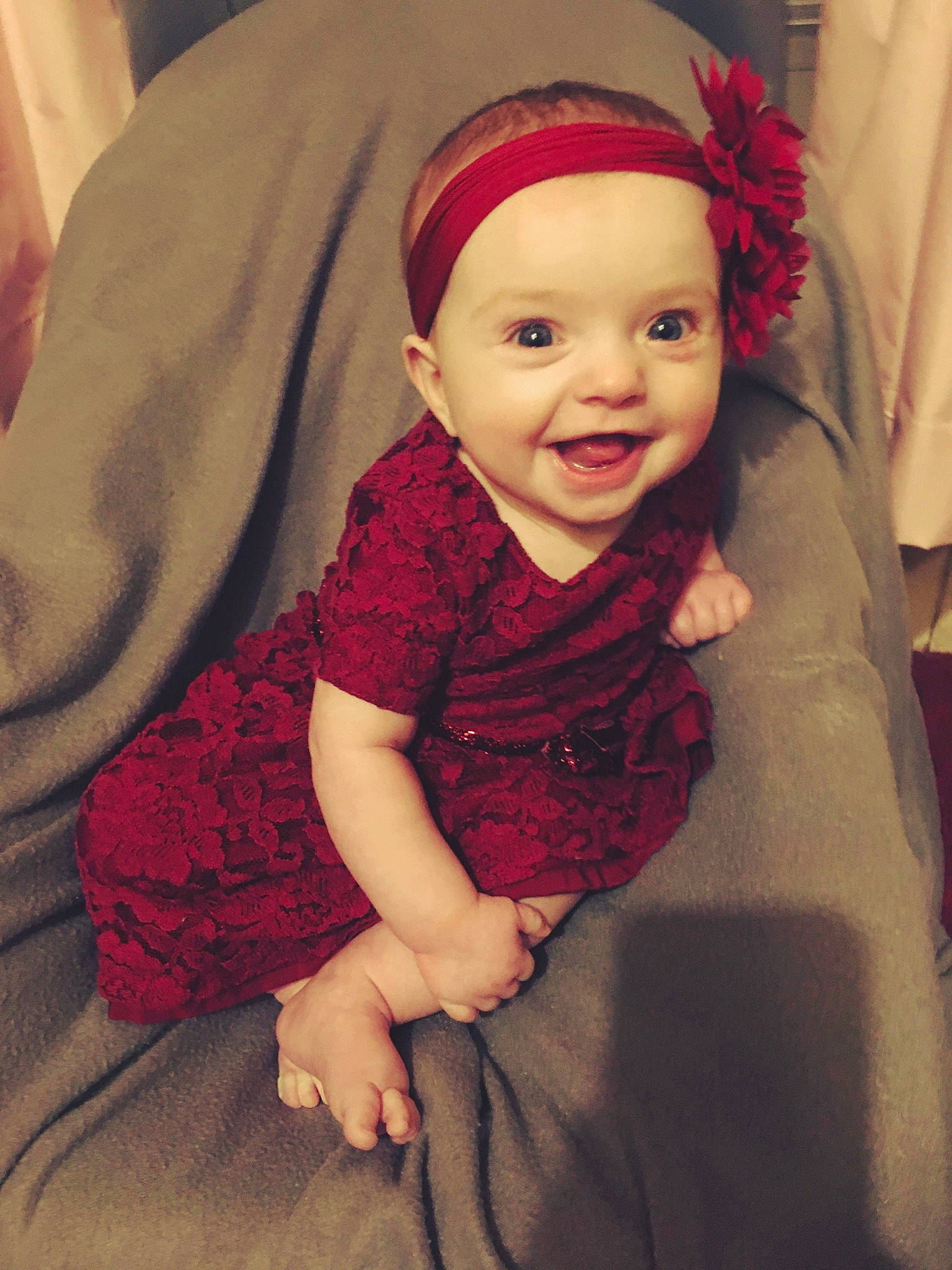 Gemma is registered to the contest to win money with this photo: baby, cheek, child, eye, face, fashion_accessory, hair_accessory, head, headband, headgear, headpiece, joy, lip, person, pink, red, skin, smile, toddler