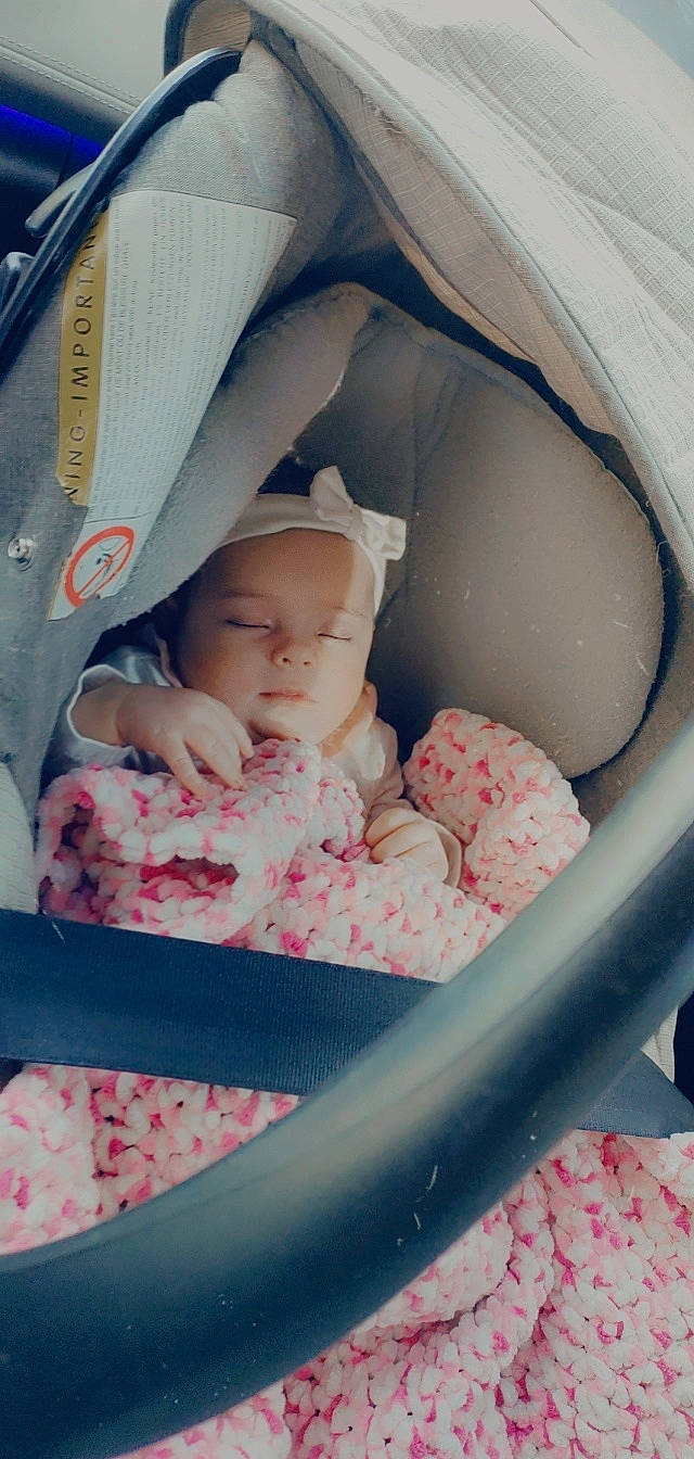 Lexy participe au concours pour gagner de l'argent avec cette photo : arm, baby, baby_carriage, baby_toddler_clothing, cheek, comfort, eye, finger, hand, head, headwear, human, human_body, infant_bed, leg, mouth, person, pink, product, skin