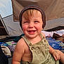 toddler, child, smiling, hat, overalls, tent, camping, outdoor, happy, baby, clothing, portrait, person, fabric, blanket, playful, cute, nature, daylight, seated