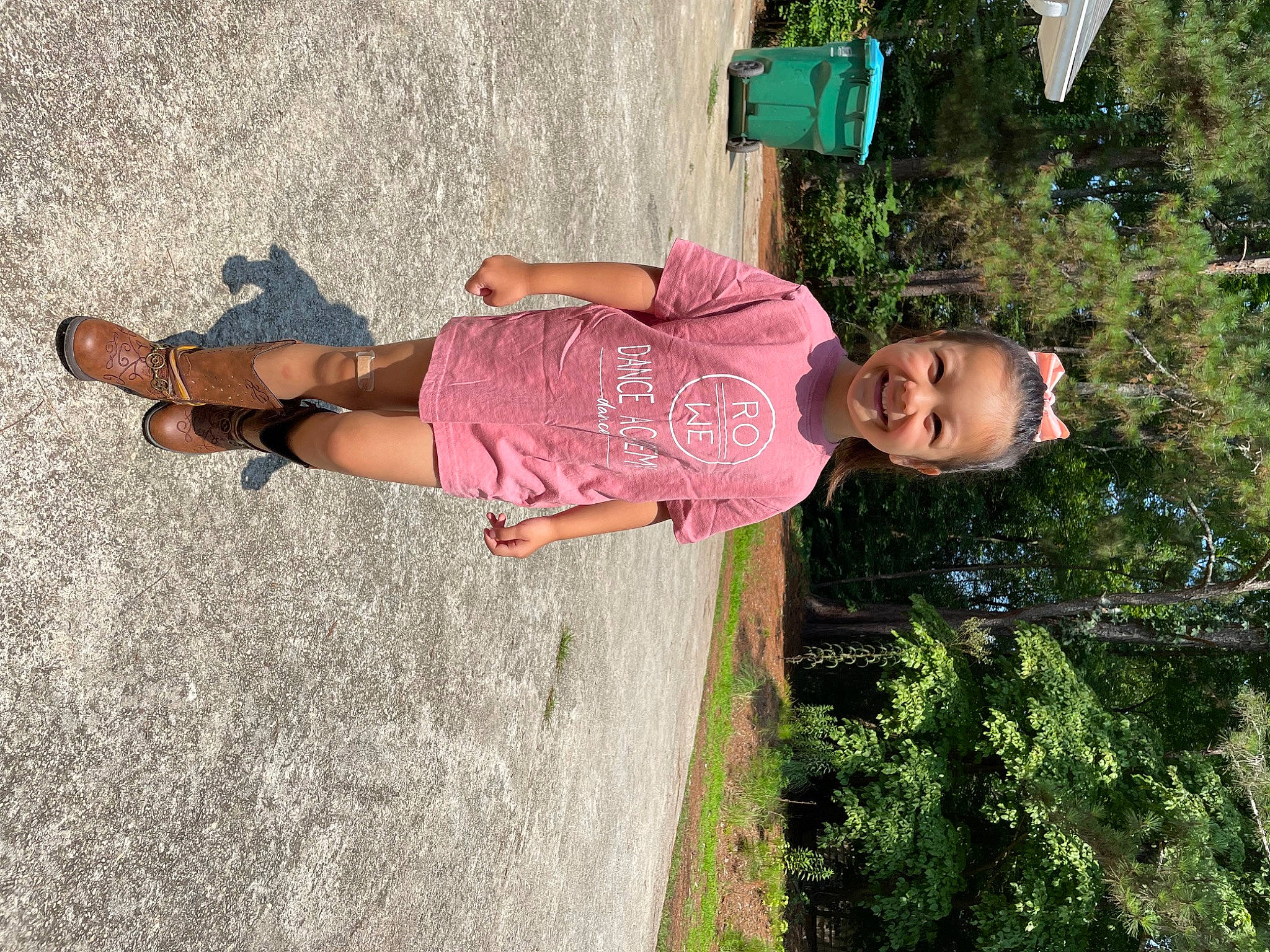 Brighton is registered to the contest to win money with this photo: arm, baby, baby_toddler_clothing, child, fun, grass, happy, human_leg, joy, leisure, magenta, people_in_nature, person, plant, play, recreation, sandal, smile, thigh, toddler