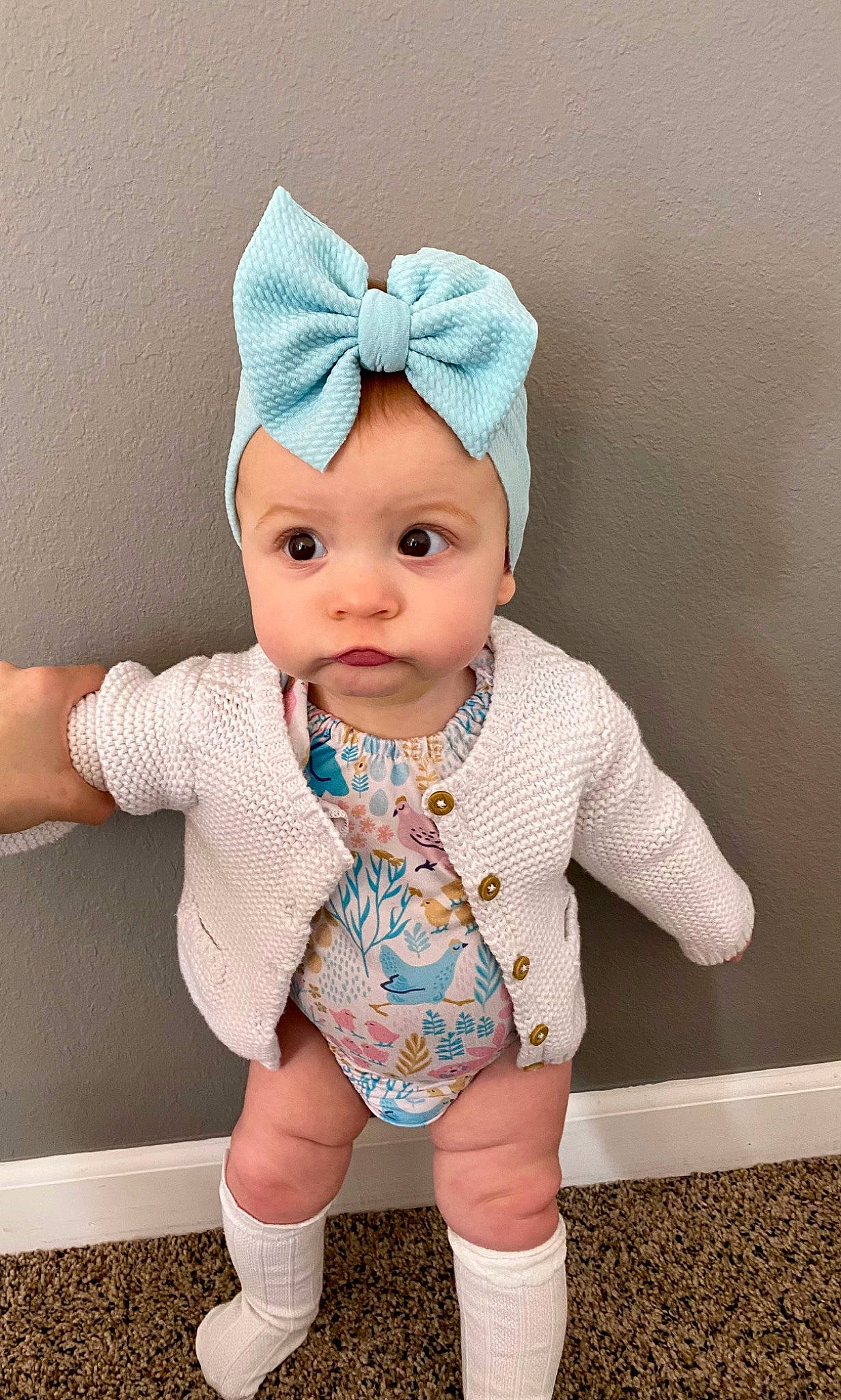 Everlee is registered to the contest to win money with this photo: baby, baby_toddler_clothing, beanie, cap, child, costume_hat, face, fashion_accessory, finger, head, headgear, headpiece, headwear, knit_cap, pattern, peach, person, pink, sleeve, textile