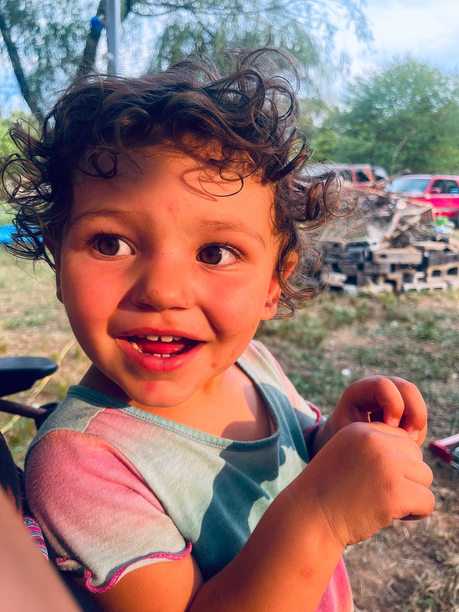 Raven is registered to the contest to win money with this photo: adaptation, child, finger, fun, grass, hand, happy, joy, leisure, lip, mouth, nose, people_in_nature, person, plant, recreation, skin, sky, smile, summer