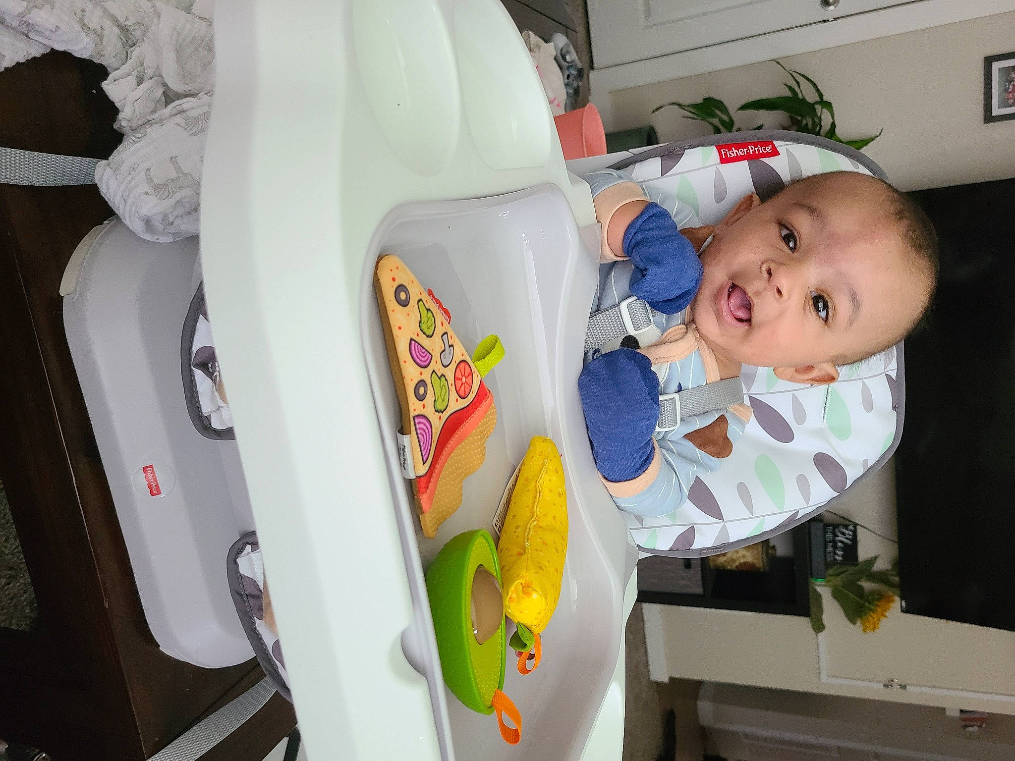 Kato is registered to the contest to win money with this photo: automotive_design, baby, baby_laughing, baby_products, baby_safety, baby_toddler_clothing, chair, child, houseplant, laundry_room, person, picture_frame, plant, product, refrigerator, room, smile, t_shirt, textile, toddler