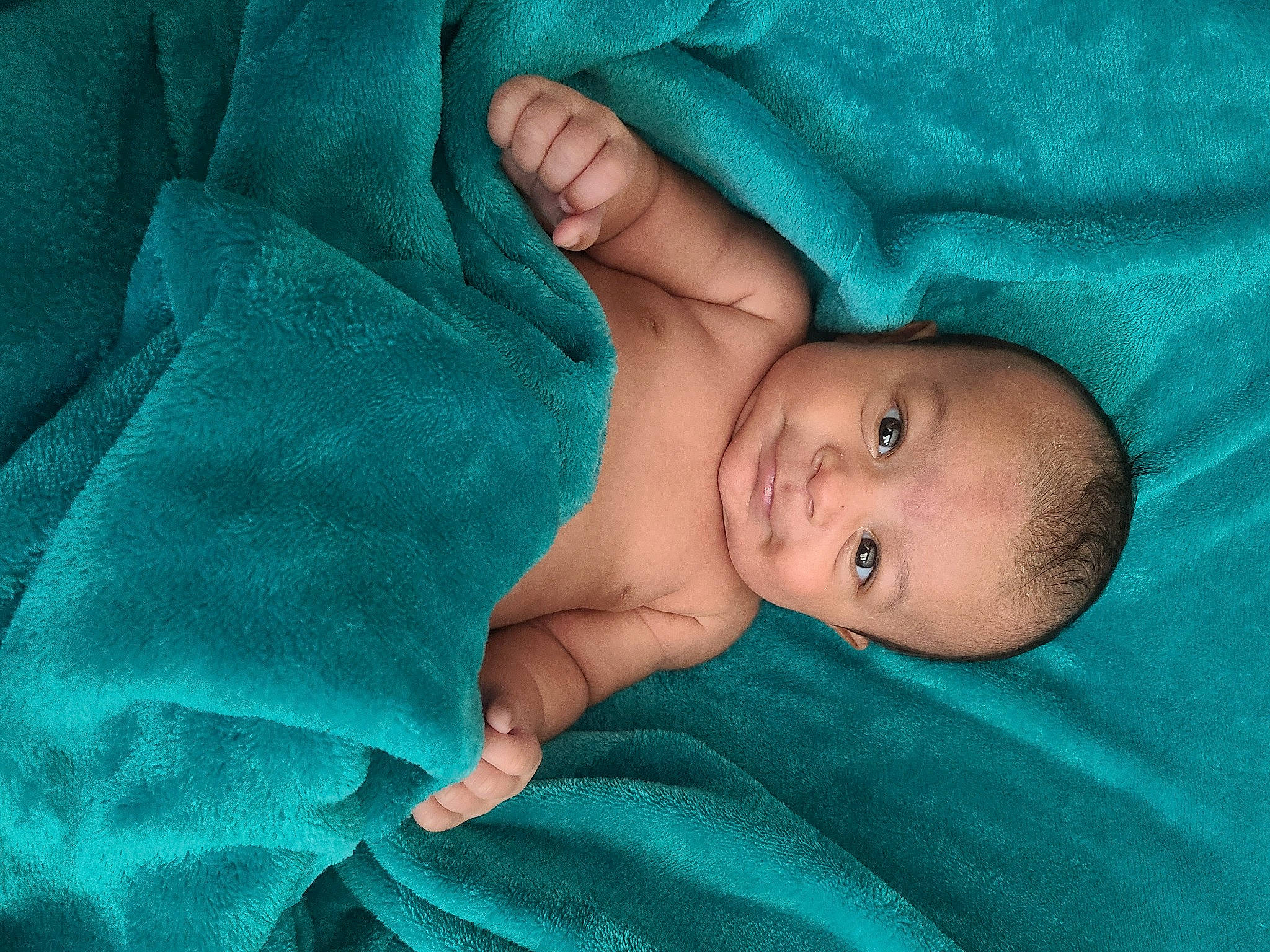 Kato is registered to the contest to win money with this photo: aqua, azure, baby, baby_products, baby_toddler_clothing, bedtime, child, comfort, electric_blue, face, iris, linens, person, room, skin, sleep, textile, toddler