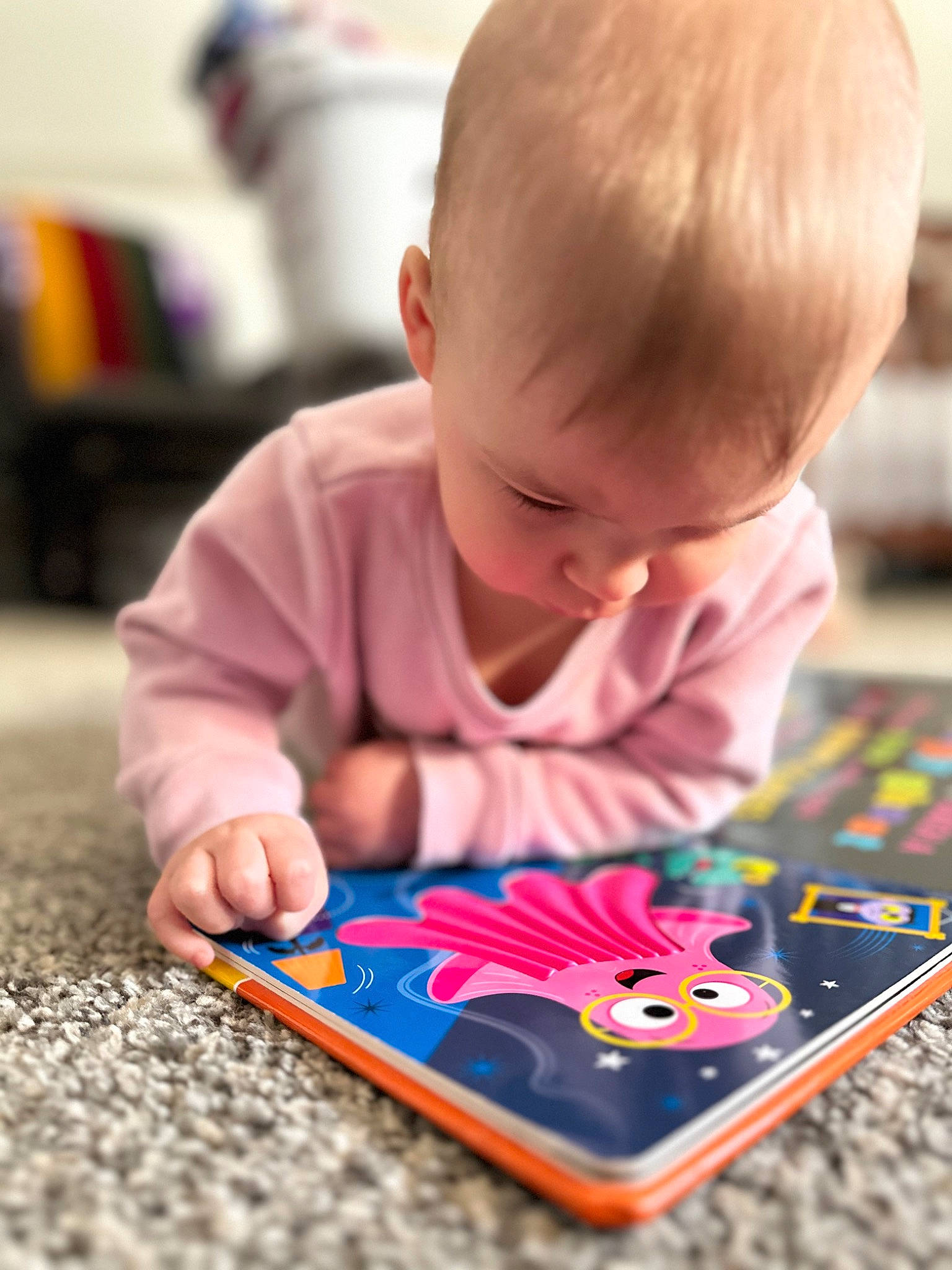 Delilah is registered to the contest to win money with this photo: baby, baby_playing_with_toys, child, communication_device, curious, flooring, fun, gadget, learning, leisure, person, play, product, reading, recreation, room, sharing, sitting, tablet_computer, toddler