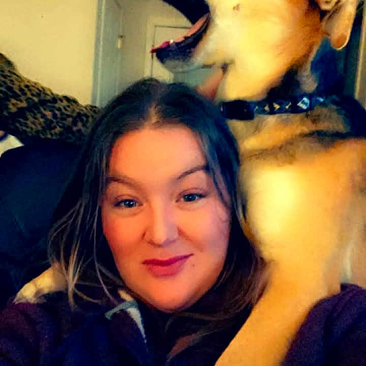 Charlie is registered to the contest to win money with this photo: adult, animal, canine, clothing, coat, dog, face, female, head, hound, husky, indoors, jacket, person, pet, photography, portrait, puppy, selfie, woman