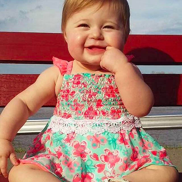 Braelynn joined the competition — help win amazing prizes! abdomen, child, child_model, clothing, eating, facial_expression, girl, hairstyle, human_positions, infant, joy, organ, person, pink, play, sitting, toddler