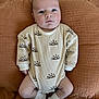 Beau joined the competition — help win amazing prizes! baby, infant, onesie, clothing, pattern, sun, blanket, bed, texture, soft, face, legs, socks, cute, child, newborn, portrait, lying_down, indoors, cozy