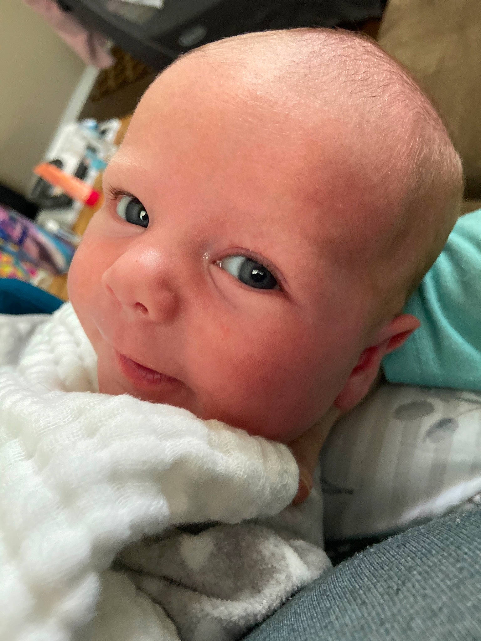 Amalia is registered to the contest to win money with this photo: baby, cheek, child, chin, comfort, ear, eyebrow, eyelash, finger, gesture, iris, linens, lip, mouth, nail, no_expression, nose, person, skin, thumb