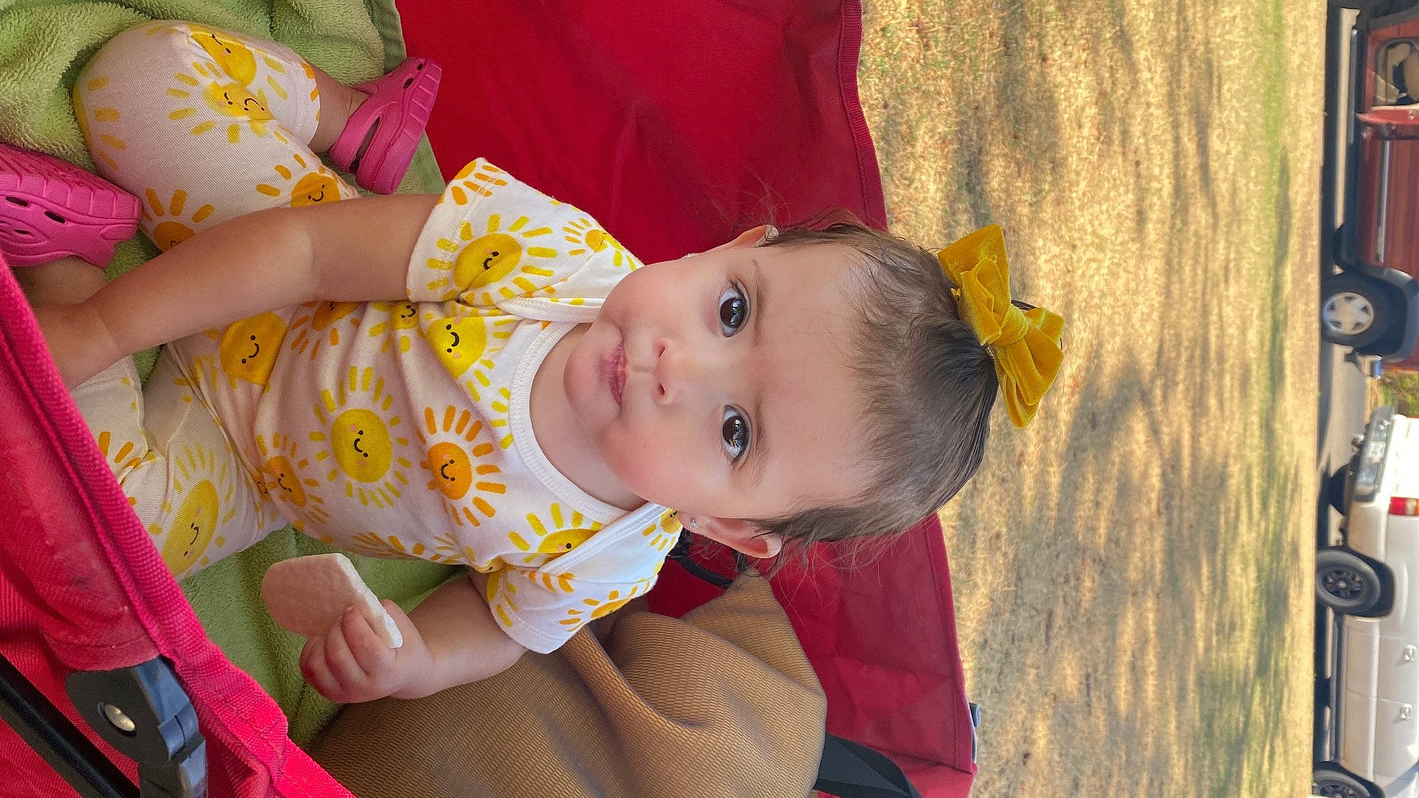 Aria joined the competition — help win amazing prizes! baby, baby_products, baby_toddler_clothing, cheek, child, dress, eye, face, fun, happy, head, iris, orange, pattern, person, sitting, skin, smile, textile, toddler