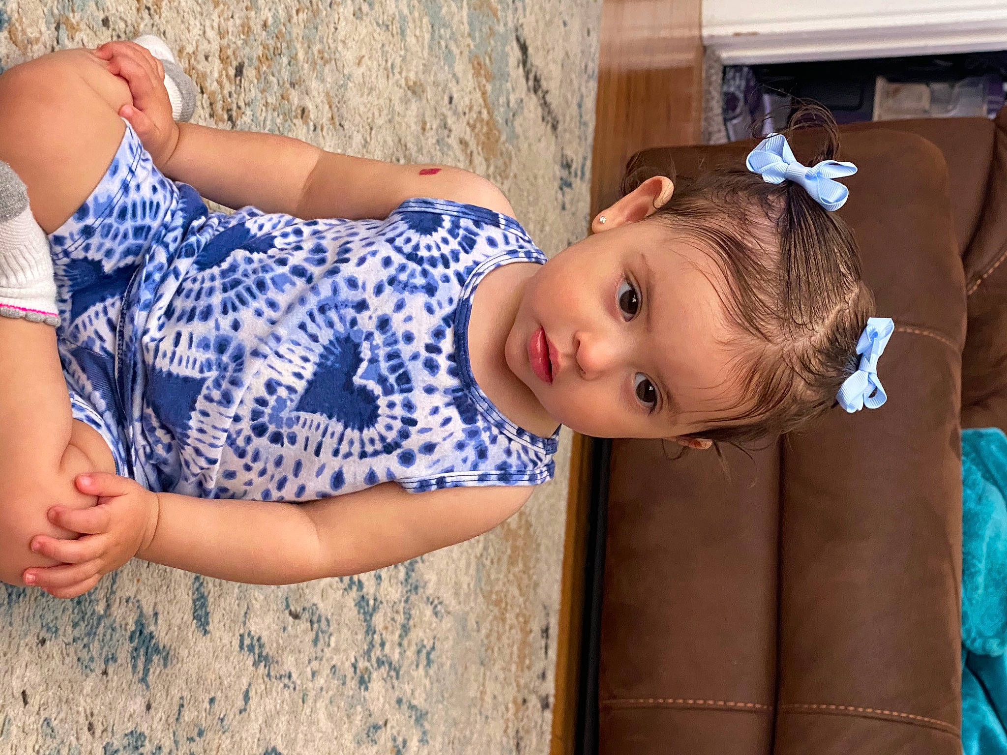 Aria is registered to the contest to win money with this photo: child, denim, dress, elbow, electric_blue, eyewear, fun, grass, happy, human, human_leg, leisure, pattern, person, shoulder, sitting, skin, thigh, toddler, tree