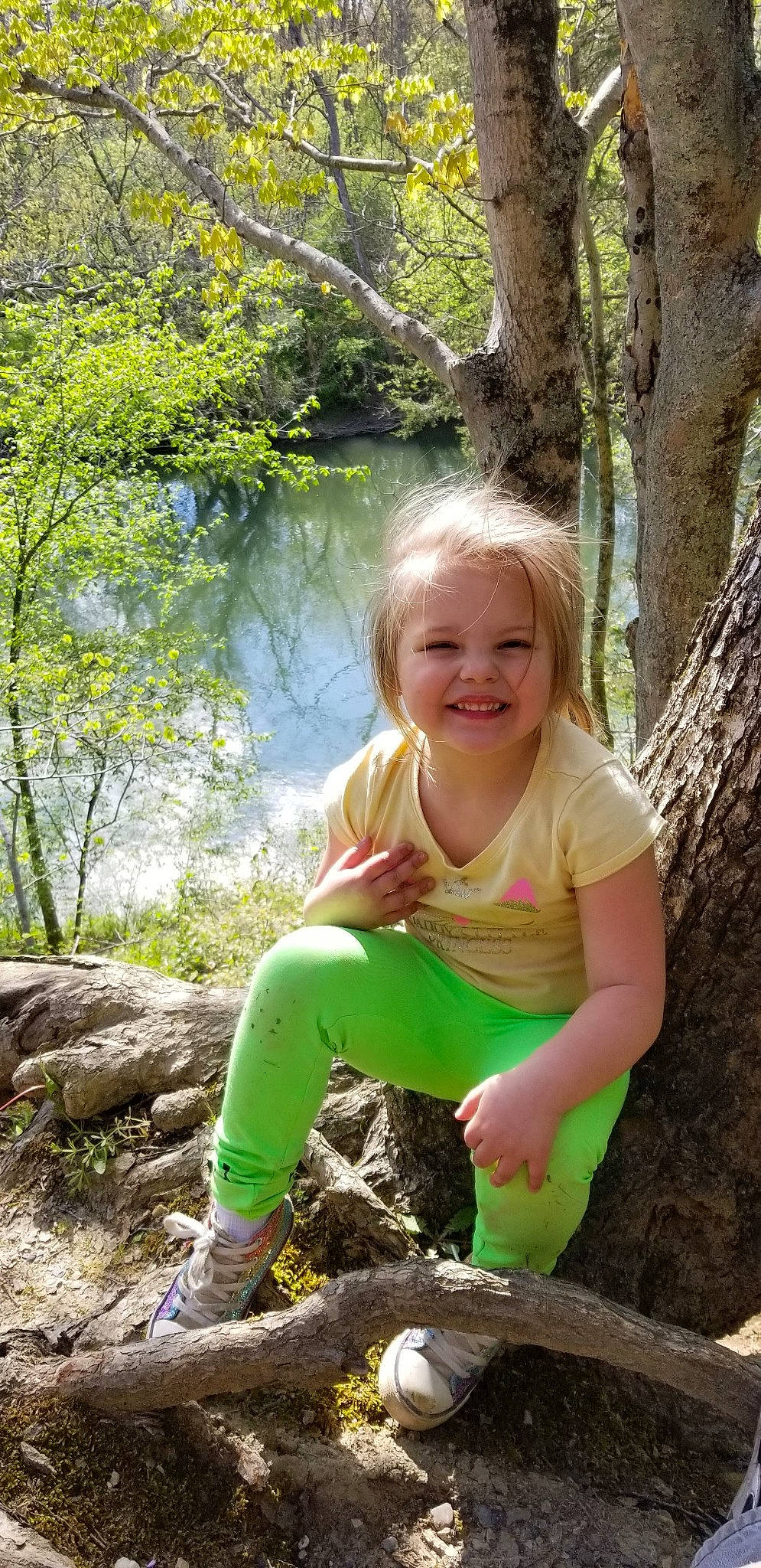 Sophia is registered to the contest to win money with this photo: adaptation, child, fawn, fun, green, joy, leisure, person, plant, play, rock, sitting, smile, toddler, tree, trunk, vacation, woodland