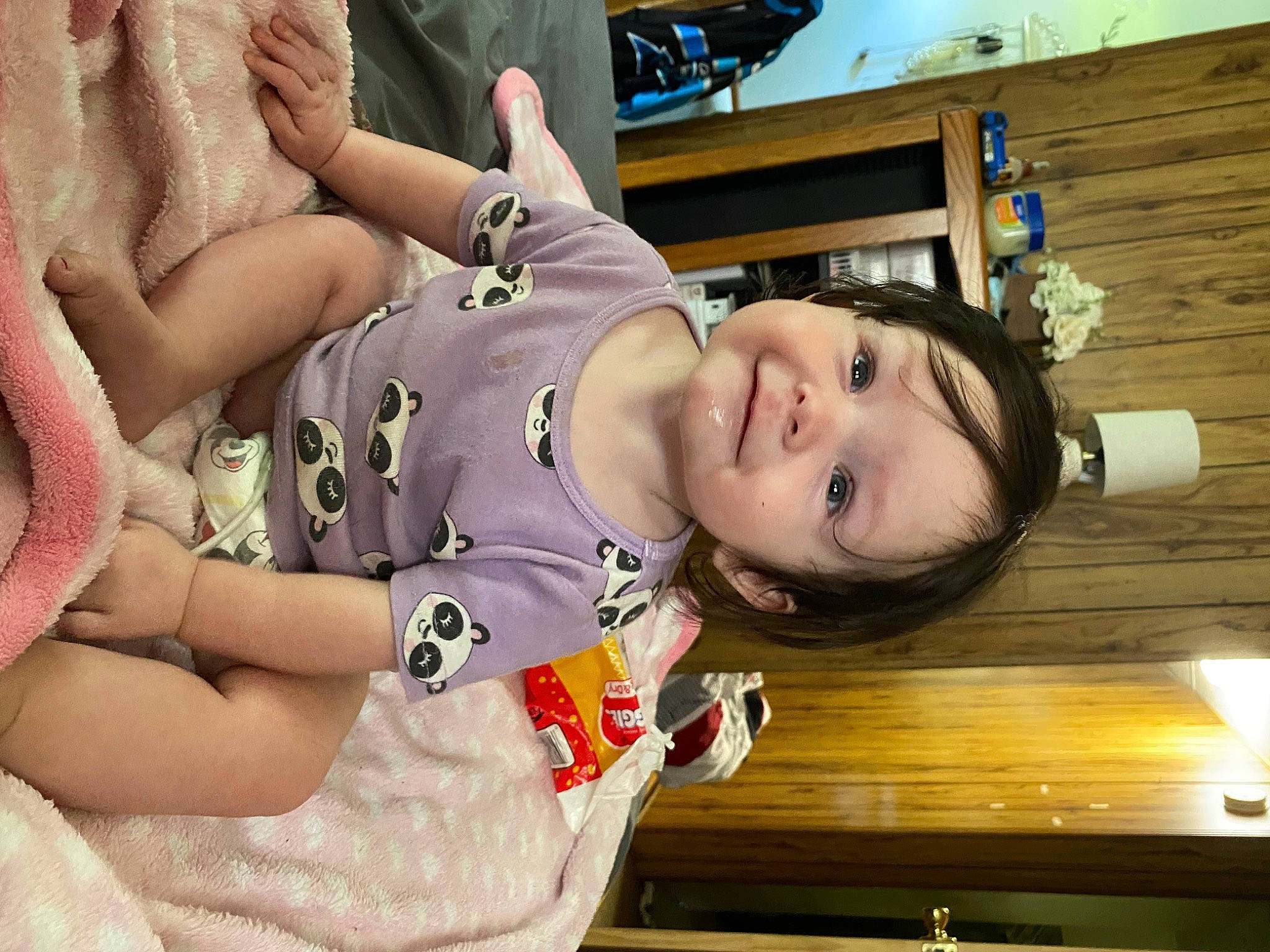 Layla is registered to the contest to win money with this photo: arm, baby, baby_toddler_clothing, bangs, cheek, child, comfort, fun, happy, joy, pattern, person, portrait_photography, room, sitting, skin, sleeve, smile, thigh, toddler