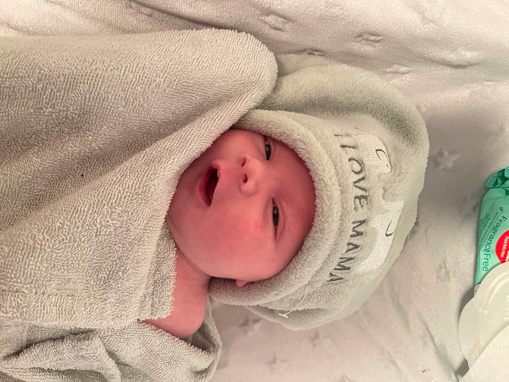 Alaska is registered to the contest to win money with this photo: baby, baby_sleeping, baby_toddler_clothing, cheek, comfort, eye, eyebrow, eyelash, face, happy, headgear, headwear, iris, linens, lip, nose, person, skin, sleeve, smile