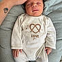 Leyann a rejoint le concours — aidez-le/la à gagner de superbes lots ! newborn, baby, sleeping, infant, onesie, hand, tattoo, heart, paw, pretzel, love, cushion, gray, soft, cozy, resting, peaceful, cute, clothing, portrait