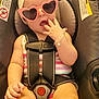 Josslyn joined the competition — help win amazing prizes! baby, child, car_seat, sunglasses, heart_shaped, headband, bracelet, safety_harness, infant, cute, fashion, exploring, fingers, legs, pink, striped_clothing, seatbelt, adorable, portrait, indoor